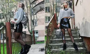 Szara bluzka oversize i błyszcząca, czarna skórzana spódnica mini tworzą stylowy zestaw. Do tego rybaczki, botki i srebrny plecaczek.
