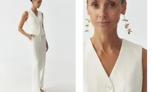 Elegancka kobieta w białej kamizelce i spodniach pokazuje, jak nosić kamizelkę na co dzień i od święta.