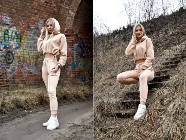 Blondynka w beżowym dresie pokazuje, jak nosić dresy na co dzień. Stylizacja z crop topem i sneakersami.